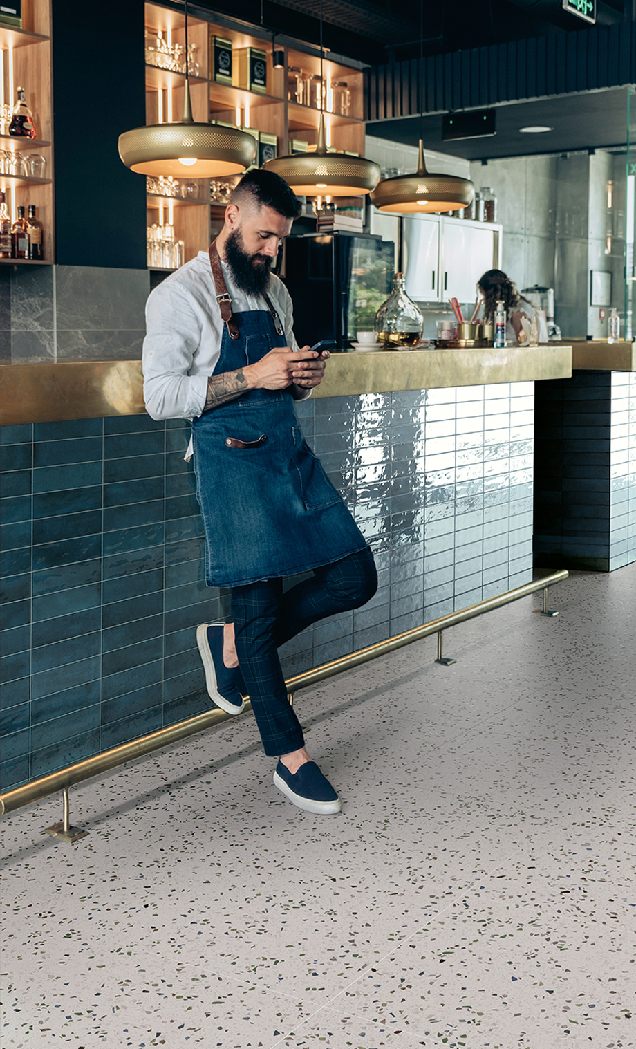 Handsome,Barista,Using,Mobile,Phone,In,A,Cafe.,Serious,Waiter